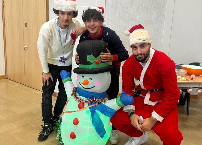 studnets at Highlands Winter Wonderland with snowman