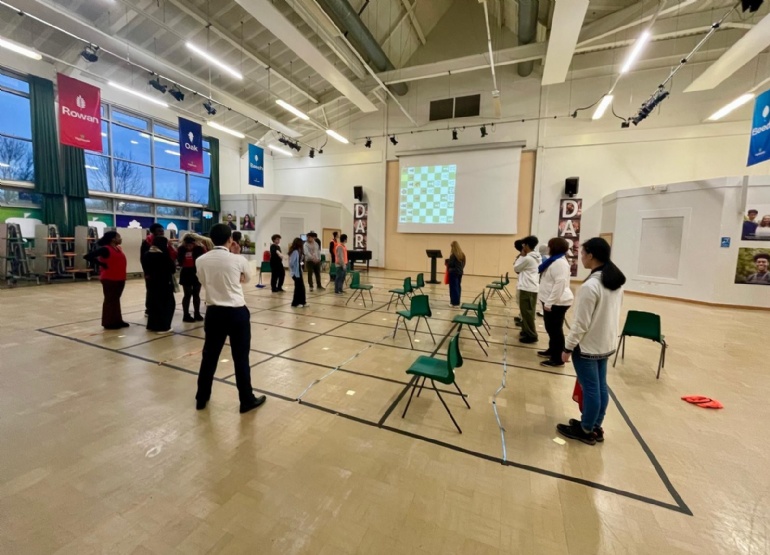 Sixth form human chess in main hall